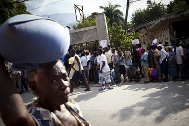 People queueing for food aid eleven days after an earthquake hit the country. A 7.0 magnitude earthquake struck Haiti on 12/01/2010. Early reports indicated that more than 100,000 may have been killed...