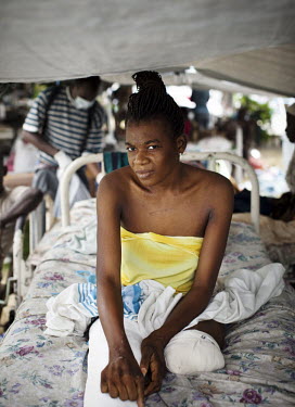 A woman whose leg was amputated after the earthquake being treated in a clinic run by the NGO Handicap International.A 7.0 magnitude earthquake struck Haiti on 12/01/2010. Early reports indicated that...