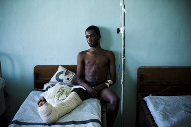A man in Chancerelle hospital, where Medecins Sans Frontieres (MSF) are treating people injured when an earthquake hit the country. A 7.0 magnitude earthquake struck Haiti on 12/01/2010. Early reports...