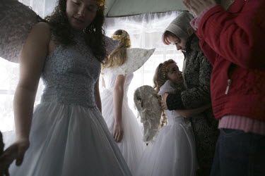 Girls dressed as angels for a Christmas perfomance in  Pilipovets village in the southwestern region of Zakarpattia. Formerly known as Subcarpathian Rus, this region in the Carpathian Mountains border...
