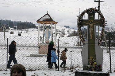 People on their way to church in the southwestern region of Zakarpattia. Formerly known as Subcarpathian Rus, this region in the Carpathian Mountains borders four countries.