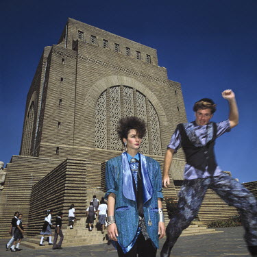 Fashion designers Shanie Boerstra and Jerome Argue pose in front of the Voortrekker Monument.