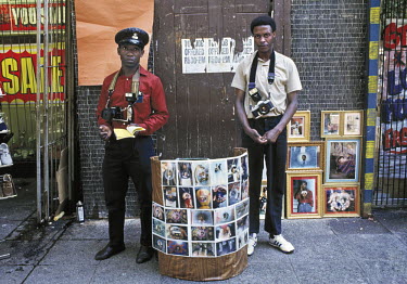 Street photographers Petrus Seadira (left) and Ruben Modise at their stall in the Hoek Street Mall.