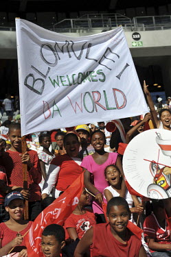 Fans at the opening match at Cape Town's new 2010 FIFA World Cup football stadium. Blomvlei is a suburb of the city. 20,000 fans flocked to the stadium for its first public event since completion in D...
