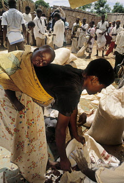 Food relief is distributed to a small village in a drought affected area.