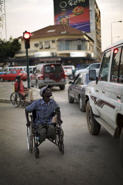 An amputee begs on the streets of the Angolan capital Luanda.