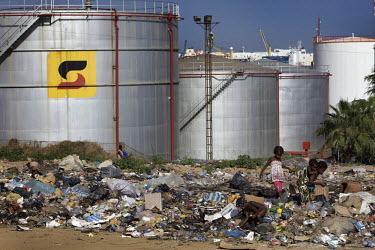 Children pick through rubbish dumped beside a Sonangol (Angolan state oil company) complex. Angola is now Africa's second largest producer of oil.