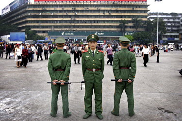 Soldiers keep watch on the public in Guangzhou's main square.