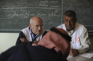 Prof. Raphi Walden (left) and his Palestinian colleague, both doctors from the Physicians for Human Rights (PHR) organisation, as they diagnose a man in a school building in the Palestinian village of...