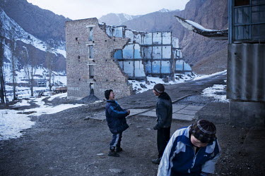 Kids playing in the city of Min Kush. During the 1960s and 70s, Min-Kush was a prosperous city living off the wealth of uranium mining. It is now an impoverished and semi-deserted village of 2,500 peo...