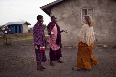 Survivors of FGM (female genital mutilation) Ngalai Lutori, 15 (left) and Naito Nagoto, 19, talk with Gemma Enolengila at the Noonkondin Secondary School. Gemma, who is British, worked with Lesikar Ol...