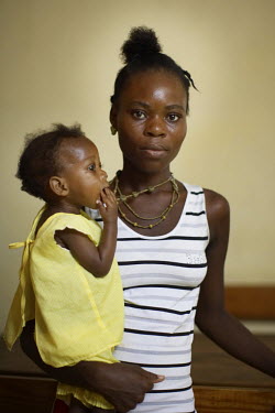 Carline Personna, 18, with her son Elinio Casimir, at a feeding centre for malnourished children in Port-au-Prince.