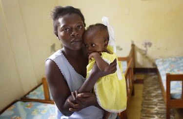 Elda St. Louis, 30, with her daughter Rosemerlinedja Joseph, at a feeding centre for malnourished children in Port-au-Prince.