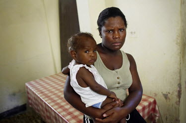 Marie-Claude Viciere, 23, with her daughter Cora Laffond, at a feeding centre for malnourished children in Port-au-Prince.