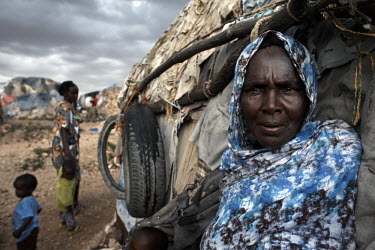 65 year-old Mumina Abdi Barre outside her home in the Kililka Shanad camp for displaced persons, on the outskirts of Hargeisa. Mumina fled to Ethiopia during the civil war in 1988 and returned in 1991...