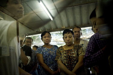 Malaria patients queue to see a doctor in Mae Tao clinic in Mae Sot. Mae Tao clinic was built to treat and help Karen people from Burma who work inside Thailand or who illegally cross the border to be...
