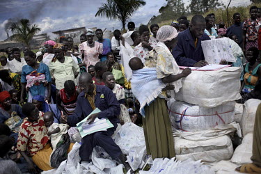 Distribution of free mosquito nets to poor families near Masindi.