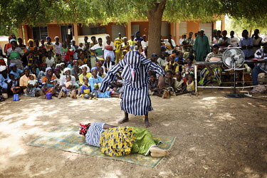 A theatre company teach local people through the use of drama about malaria and how it is transmitted.