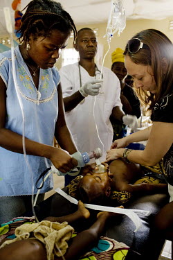 MSF (Medecins sans Frontieres) staff treat severe malaria patients at MSF Gondama hospital in Bo.