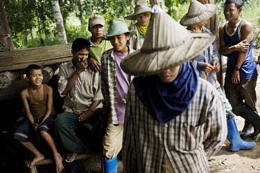 Karen malaria patients from Burma who work in Thailand queue to have a blood test at a mobile clinic. This worries the Thai authorities as many of the Karen people from Burma bring the malaria parasit...