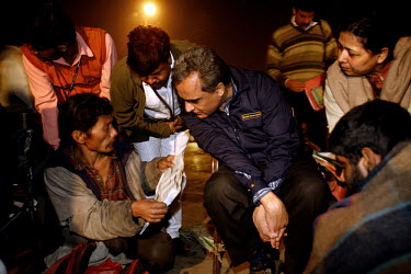 Dr Nimesh Desai, head psychiatrist at the Institute of Human Behaviour and Allied Sciences (IHBAS) in Delhi assesses a homeless and mentally unstable man for treatment with an anti-psychotic drug. The...