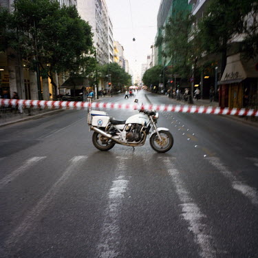 A street closed to the traffic by the police due to a demonstration in the centre of Athens during the financial crisis.