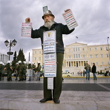 A street preacher standing in front of the Parliament building in Syntagma Square.