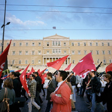 Greek Communist Party supporters demonstrating in front of the parliament building in Syntagma Square during the financial crisis.