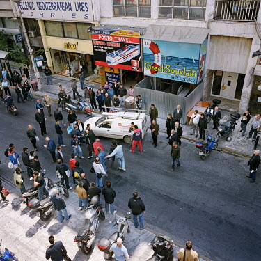Strikers from Piraeus Port arguing with two workers in the street at the end of a demonstration during the financial crisis.