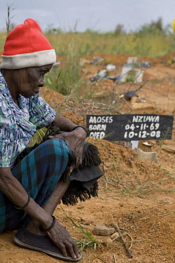 70 year old Sisilia visits the unmarked grave of her granddaughter Melody, who died from cholera aged 18. The number of deaths from cholera in Zimbabwe steadily increased towards the end of 2008.