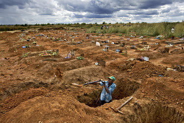 Gravedigger Elijah in a cemetery in a suburb of Harare.