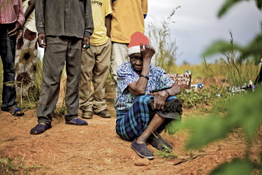 70 year old Sisilia visits the unmarked grave of her granddaughter Melody, who died from cholera aged 18. The number of deaths from cholera in Zimbabwe steadily increased towards the end of 2008.