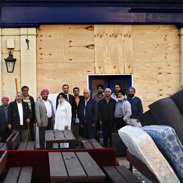 Members of the London Sikh community at the site of The Ship Aground, a loss-making pub bought with the intention of converting it into a Sikh temple.