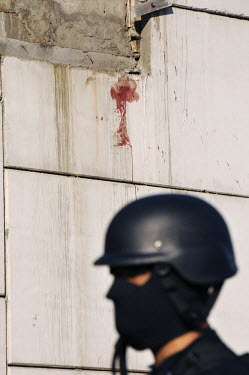 Blood on the wall of a murder scene in Culiacan.