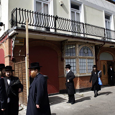 Members of the Hasidic community gather outside a newly opened synagogue housed in a building that was previously the Swan pub in Clapton, in the London Borough of Hackney. The pub was sold to a Jewis...