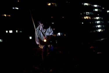 56 year old Jahid Sheikh looks for rats at night with his torch. He has been a rat catcher in the Mumbai suburbs for twenty years.