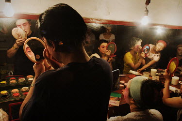 Performers apply their make-up for an evening performance at the Revolutionary Opera Society.
