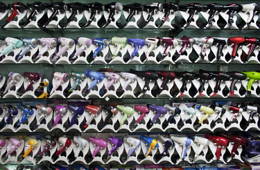A wall of hair dryers for sale displayed in the Yiwu Small Commodity Market. The city of Yiwu comprises of numerous export markets selling more than 17 million different products to more than 200 coun...