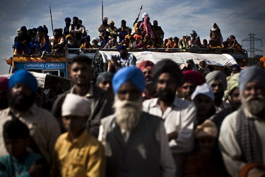 Sikhs arrive by bus and foot to attend the Hola Mohalla Festival. It takes place on the first day of the lunar month of Chet (March/April).