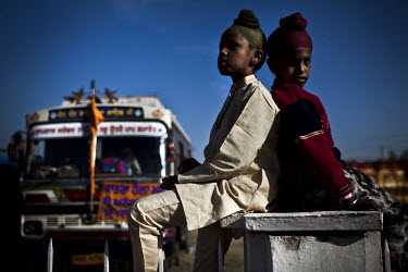 Two Sikh boys attend the Hola Mohalla Festival. It takes place on the first day of the lunar month of Chet (March/April).