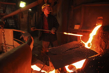 A worker smokes a cigarette as he smelts copper at a plant in Norilsk, a resource-rich city in Siberia above the Arctic Circle.
