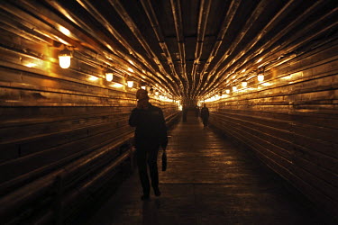 Workers in a lit tunnel at a copper plant in Norilsk, a resource-rich city in Siberia above the Arctic Circle.