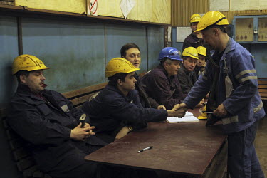 A worker shakes hands with his boss at a copper plant in Norilsk, a resource-rich city in Siberia above the Arctic Circle.