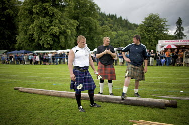 Neil Elliott (left) and other competitors prepare for the World Championships for tossing the caber at the Inveraray Highland Games, held at Inveraray Castle in Argyll.