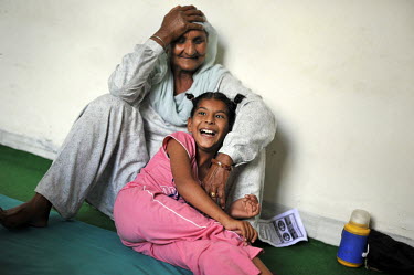 11 year old Nimrit Kaur who has birth defects sits with her grandmother in the waiting room of the privately funded Baba Farid Centre in Faridkot. An increasing and ignored percentage of children are...