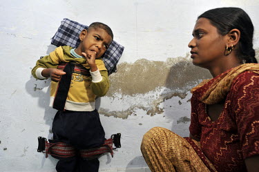 4 year old Akriti who has cerebral palsy is strapped to a wall to help straighten his limbs at the privately funded Baba Farid Centre in Faridkot. An increasing and ignored percentage of children are...