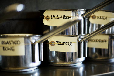 Saucepans containing different ingredients including mushroom, truffle, whey, roasted bone and woodruff in the kitchen of Rene Redzepi's two Michelin star restaurant Noma, which was voted the best res...