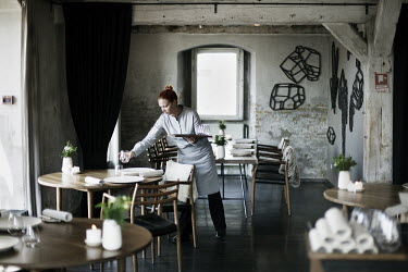 A waitress sets tables in Rene Redzepi's two Michelin star restaurant Noma, which was voted the best restaurant in the world in 2010.