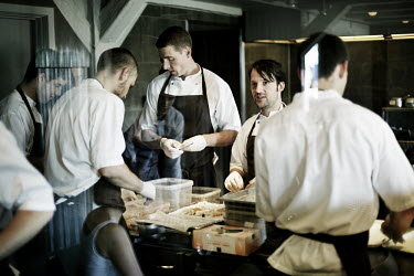 Chef Rene Redzepi (centre right) works with his assistants in the kitchen of his two Michelin star restaurant Noma, which was voted the best restaurant in the world in 2010.