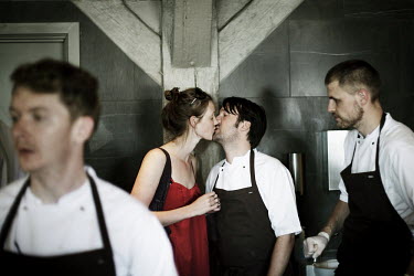 Chef Rene Redzepi kisses his wife Nadine in the kitchen of his two Michelin star restaurant Noma, which was voted the best restaurant in the world in 2010.